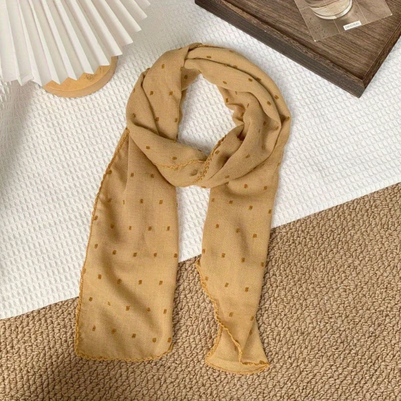Polka-dot silk scarf—a stylish and versatile small square scarf.
