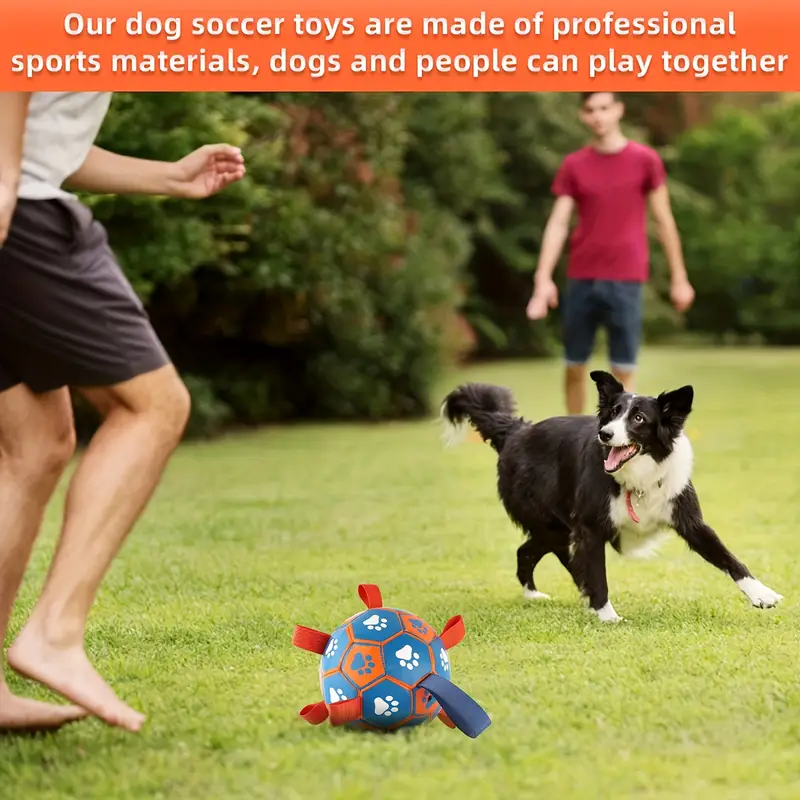 Large, thickened rubber dog soccer ball with tug-of-war straps and inflation tube.