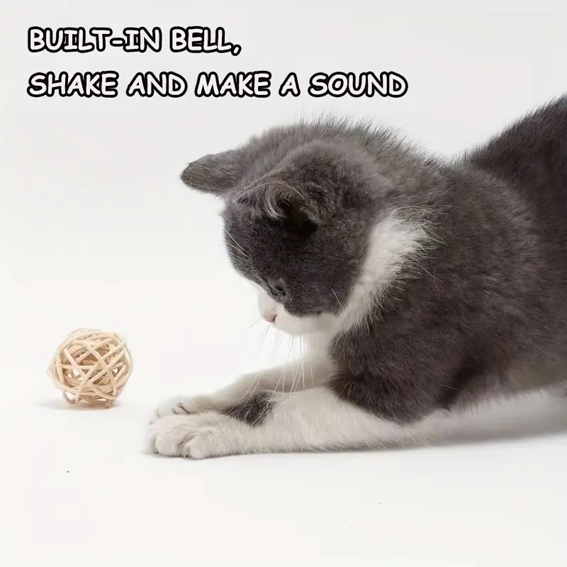 Two cat toy balls made of synthetic feathers, designed for teasing and chewing.