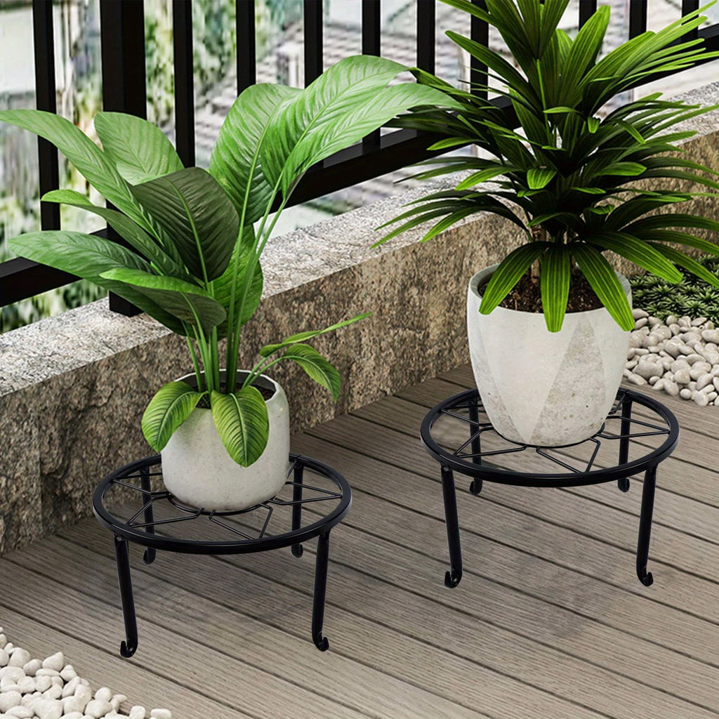 Sturdy black wrought iron stand, suitable for indoor and outdoor use.
