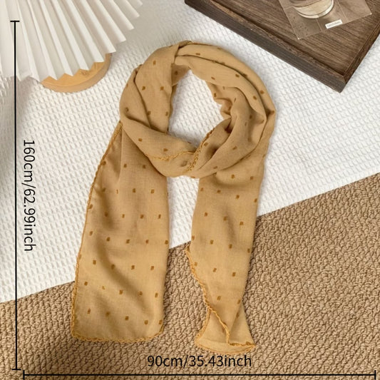 Polka-dot silk scarf—a stylish and versatile small square scarf.