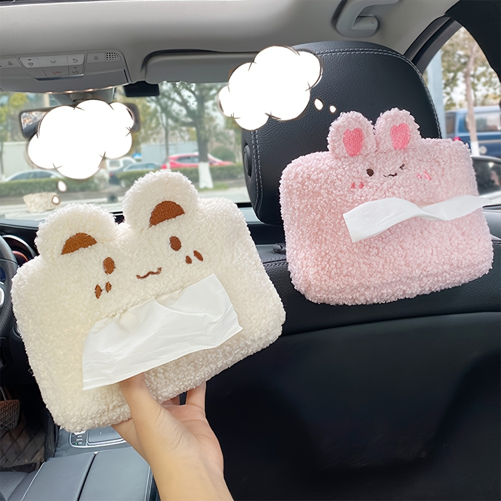 A hanging car tissue box with a cute and creative design.