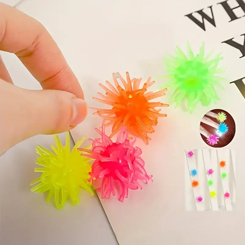 12-pack of interactive cat toy balls with suction cups, wall-climbing, made of rubber.