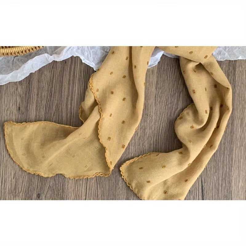 Polka-dot silk scarf—a stylish and versatile small square scarf.