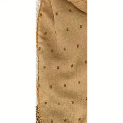 Polka-dot silk scarf—a stylish and versatile small square scarf.