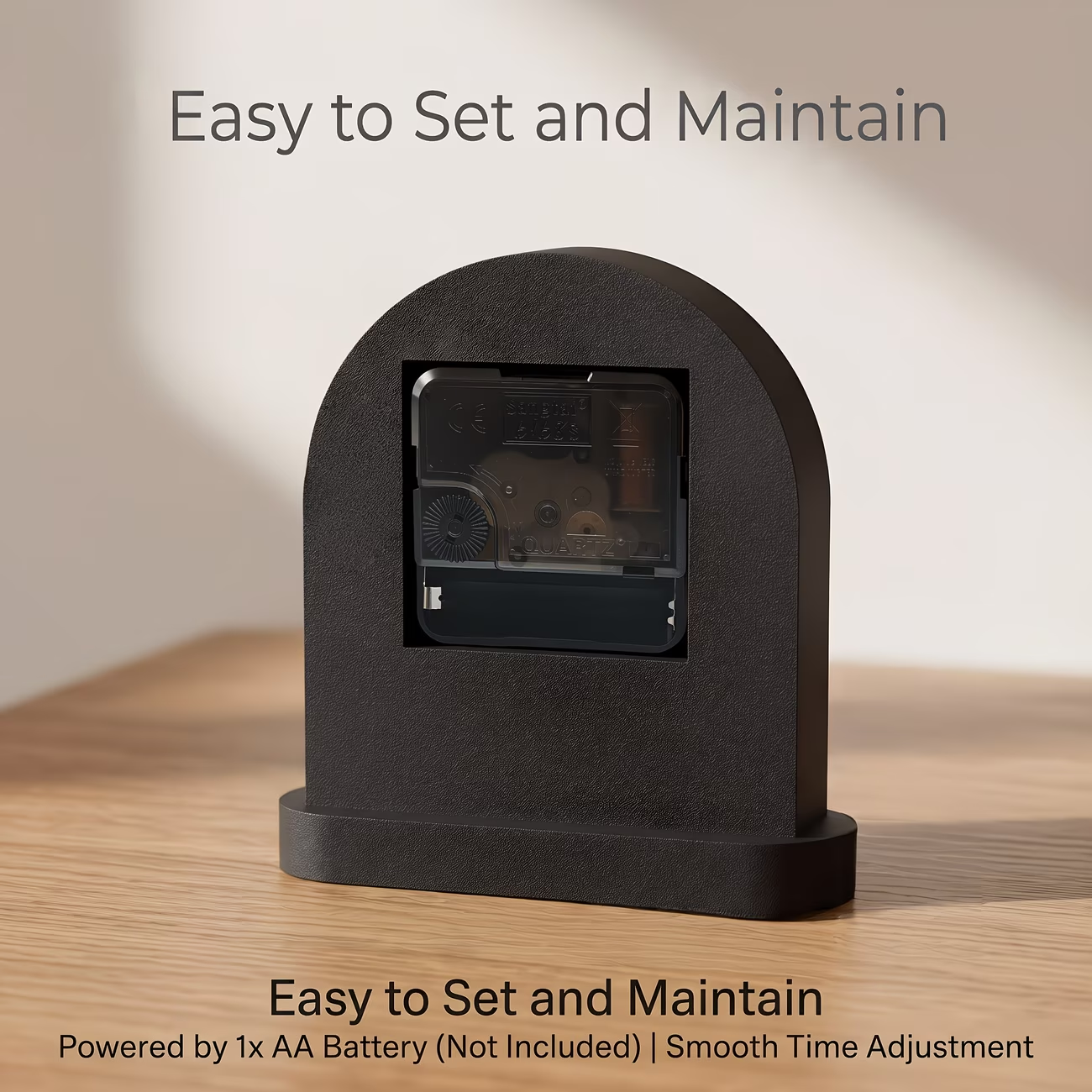 A minimalist arched desktop clock with a smooth and curved shape, suitable for various home decorations