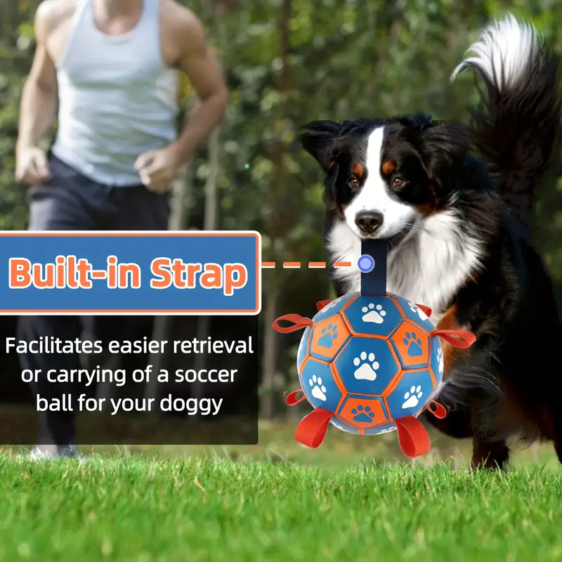 Large, thickened rubber dog soccer ball with tug-of-war straps and inflation tube.