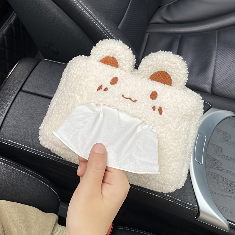 A hanging car tissue box with a cute and creative design.
